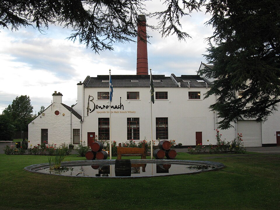 The red-brick chimney and whitewashed buildings of Benromach distillery, Forres