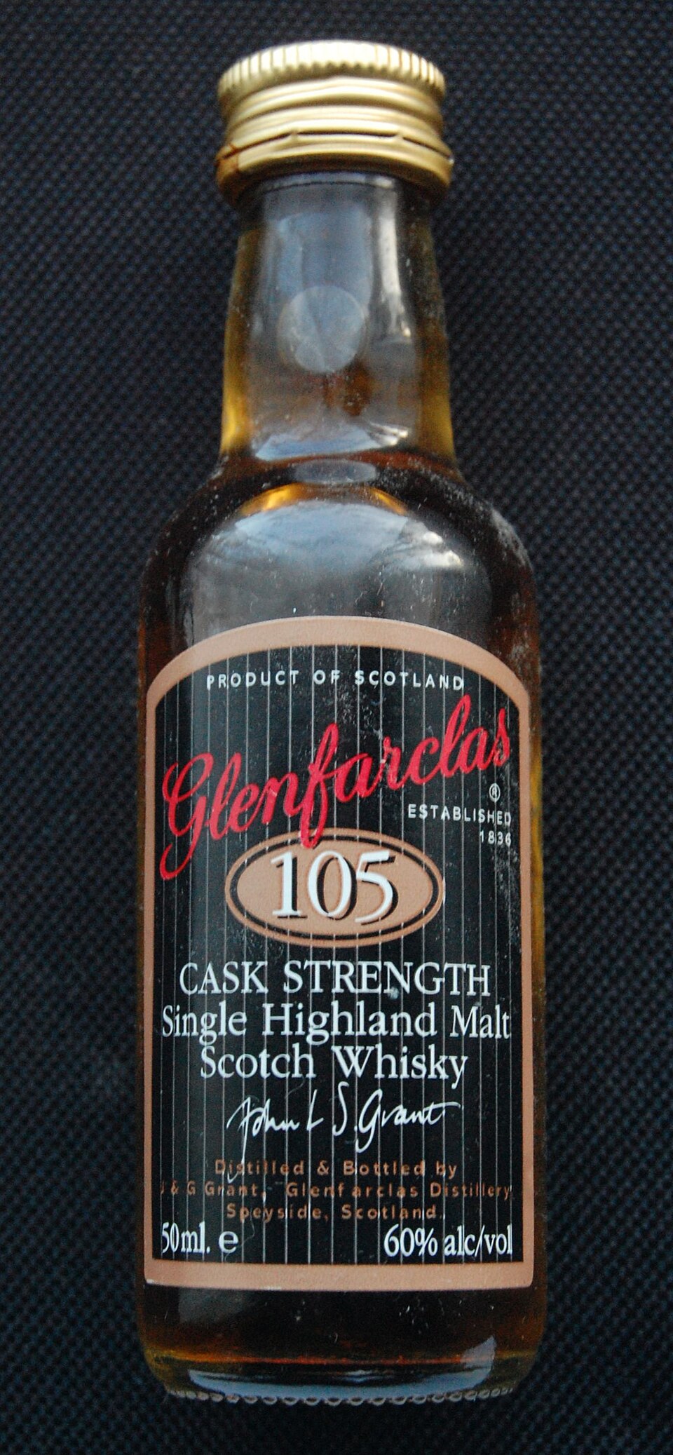 A bottle of Glenfarclas 105 cask strength single malt in its livery