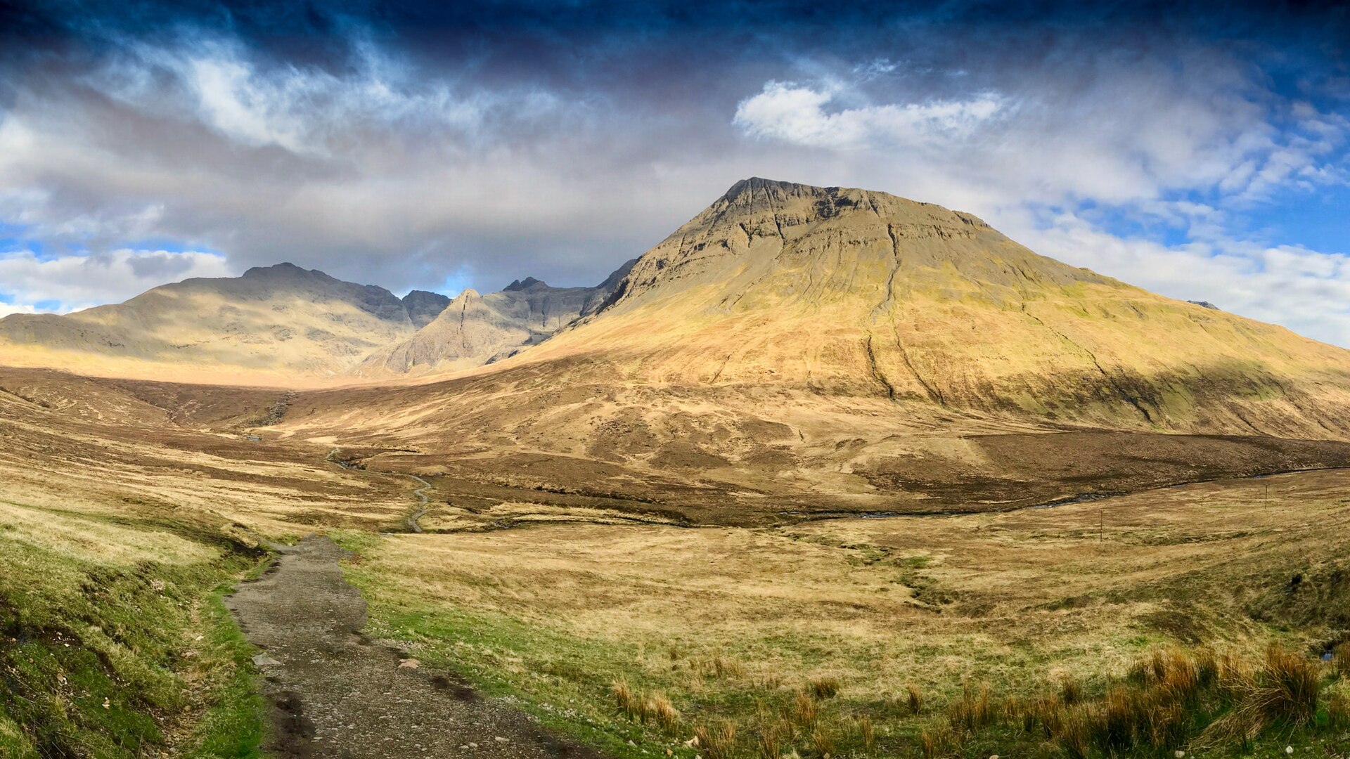 The Black Cuillin mountains rising over moorland in the Scottish Highlands